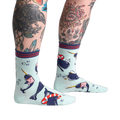 Lifestyle photo showing Whale-y Good Time socks on a model's legs, showcasing the sock's design and fit.