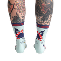 Back view of Whale-y Good Time socks on a model's legs, highlighting the design details on the back of the socks.
