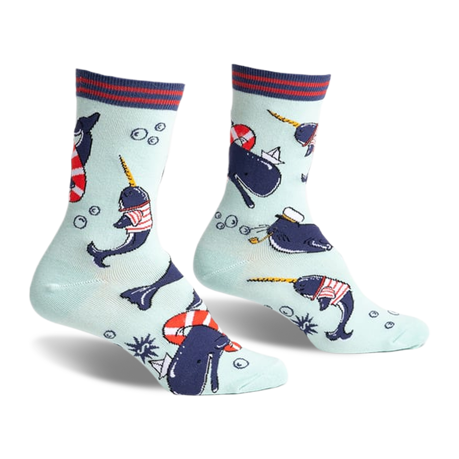 Crew socks featuring narwhals in sailor outfits, life preservers, and paper boats on a light blue background. Red, navy, and white details.
