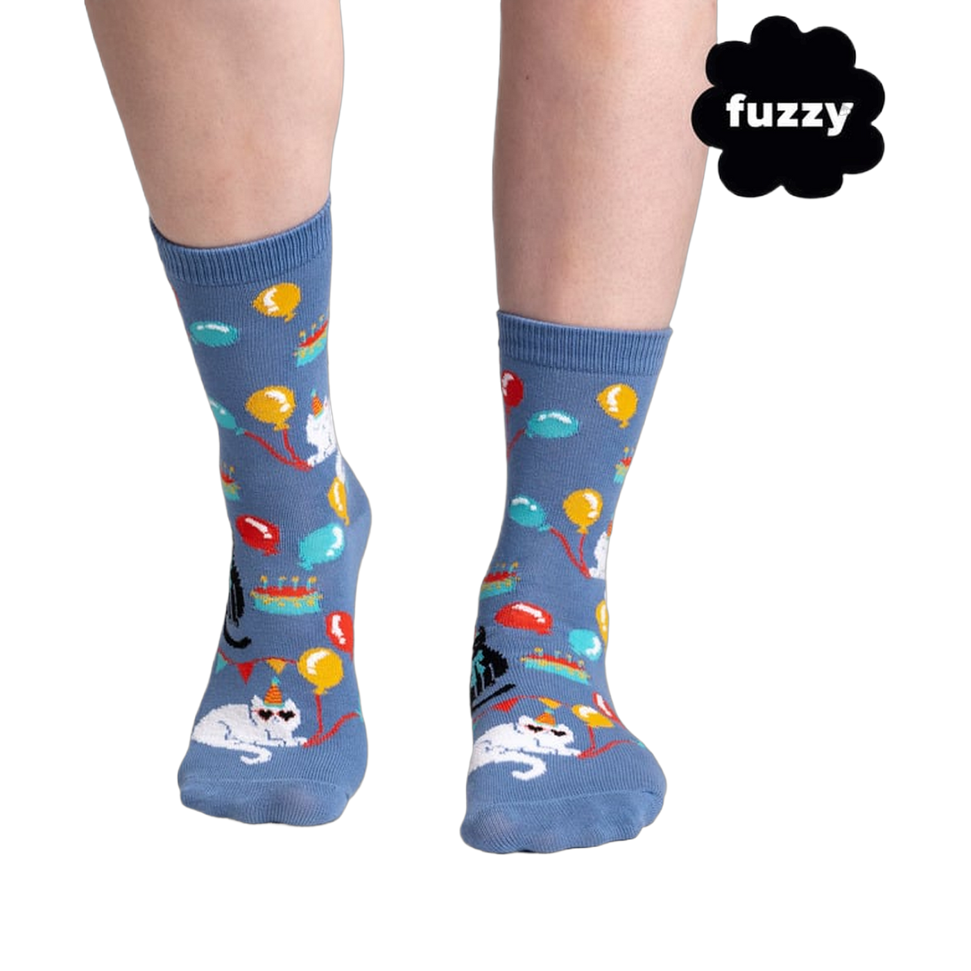 Lifestyle shot showing the socks on a person's feet. The socks are blue with a cat design.