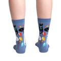 Back view of the socks showing the full design.  Blue crew socks with cats and party items.