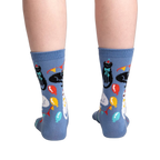 Back view of the socks showing the full design.  Blue crew socks with cats and party items.