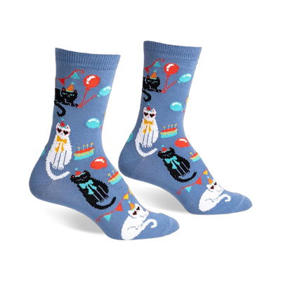 Crew socks in blue featuring black and white cats wearing party hats, balloons, and cake designs.