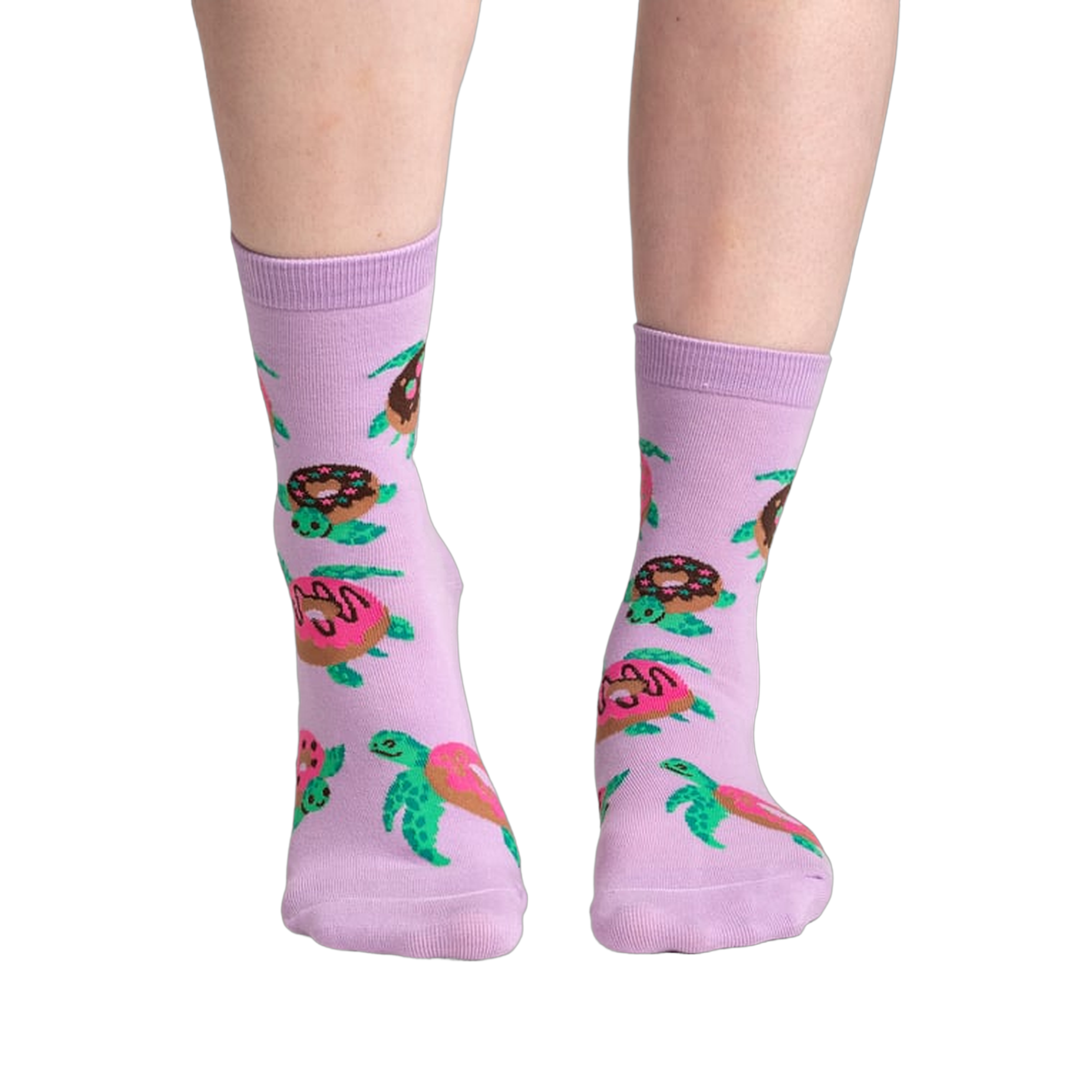Lifestyle shot of model wearing a pair of lavender crew socks with turtles and donuts.