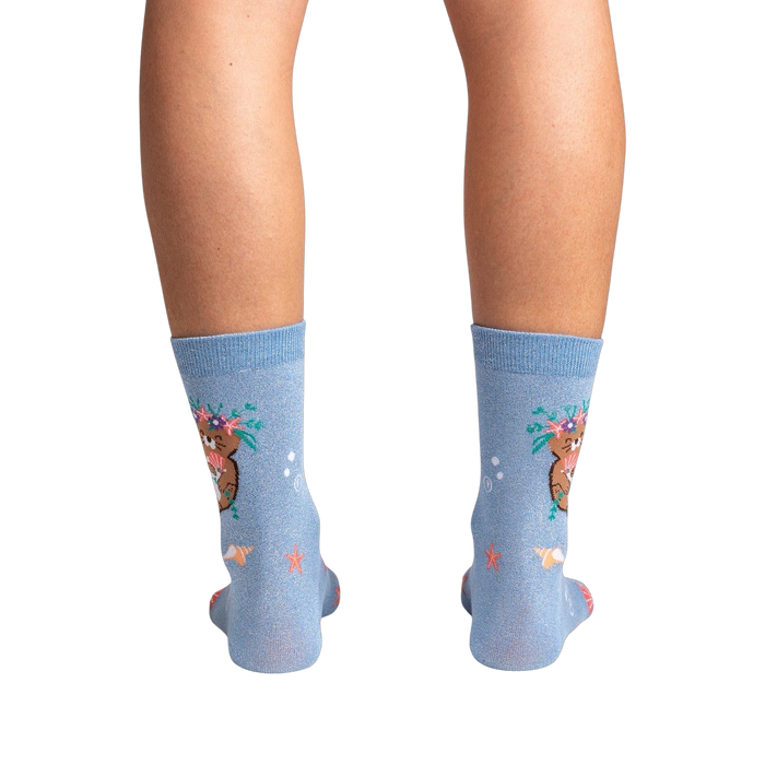 Rear view of the socks on a model's legs against a black background, showcasing the full design.