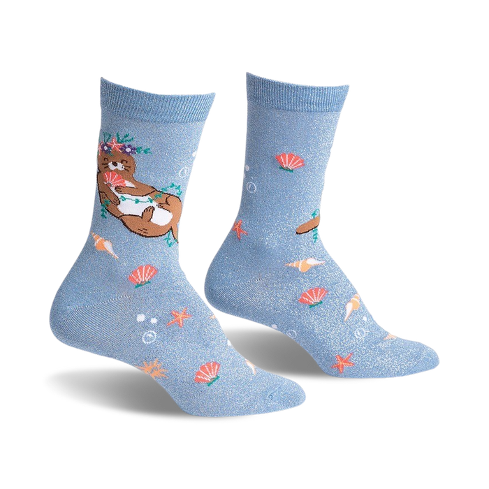  blue crew socks for women featuring cartoon otters wearing flower crowns and holding starfish.   