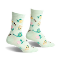 Pair of mint green crew socks with a whimsical garden design. Features bees, flowers, seed packets, and watering cans.