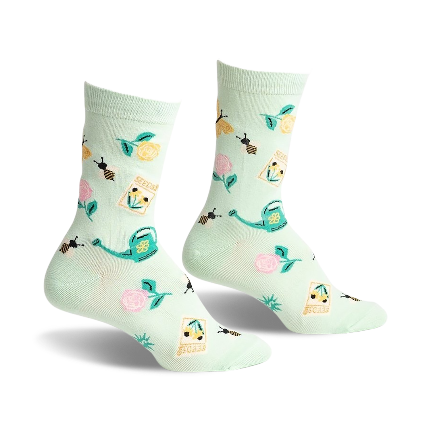 Pair of mint green crew socks with a whimsical garden design. Features bees, flowers, seed packets, and watering cans.