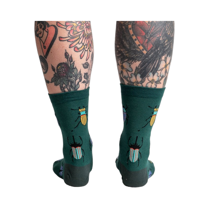 Back view of the socks highlighting the beetle pattern on the back of the leg.