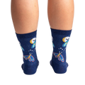 Back view of a pair of Moonlit Moth Shimmer socks on a person's legs, showing the back of the socks.