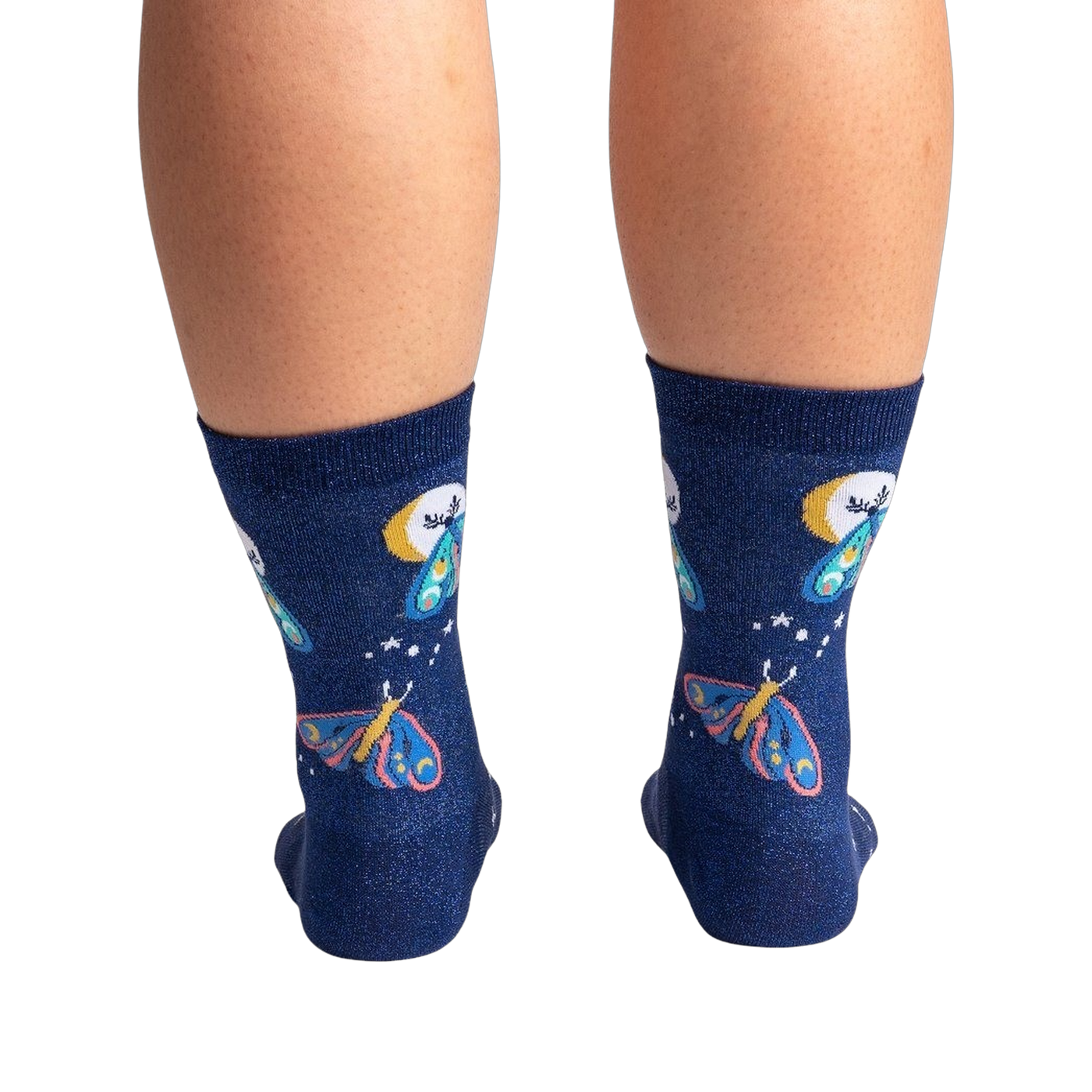Back view of a pair of Moonlit Moth Shimmer socks on a person's legs, showing the back of the socks.