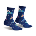 Pair of women's crew socks in dark blue glitter. Features whimsical moon and moth designs in pastel pinks, blues, and yellows.