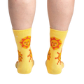 Rear view of the socks on a person's legs, highlighting the back design and fit.