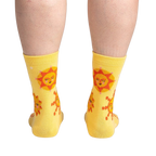 Rear view of the socks on a person's legs, highlighting the back design and fit.