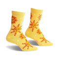 Pair of yellow crew socks with a whimsical sun and star pattern. The suns have cute faces and the background is speckled with tiny stars.