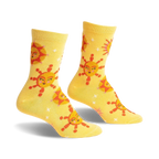 Pair of yellow crew socks with a whimsical sun and star pattern. The suns have cute faces and the background is speckled with tiny stars.