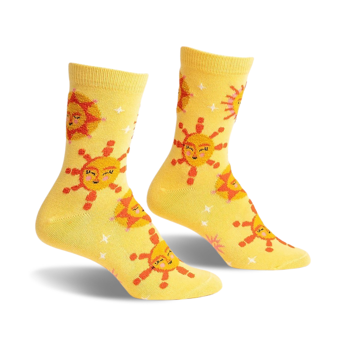 yellow crew socks with a pattern of smiling suns and white stars on a yellow background.   