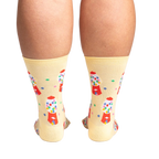 Back view of 'I Chews You' socks on a person's legs.