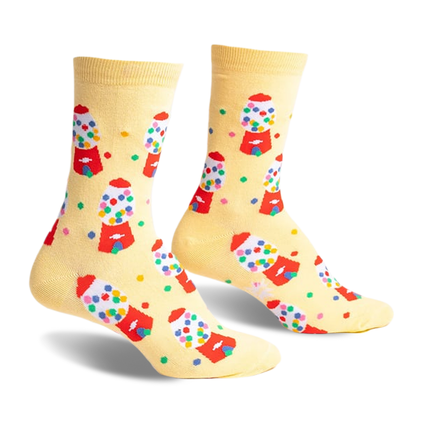 Pair of pastel yellow crew socks with a repeating pattern of colorful gumball machines and scattered gumballs.