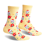 Pair of pastel yellow crew socks with a repeating pattern of colorful gumball machines and scattered gumballs.