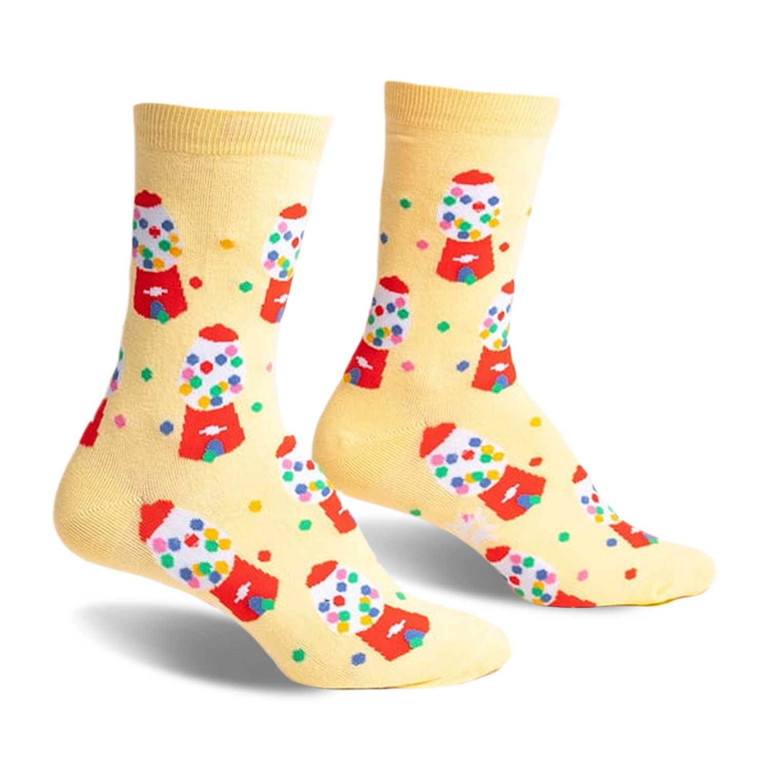 Pair of pastel yellow crew socks with a repeating pattern of colorful gumball machines and scattered gumballs.