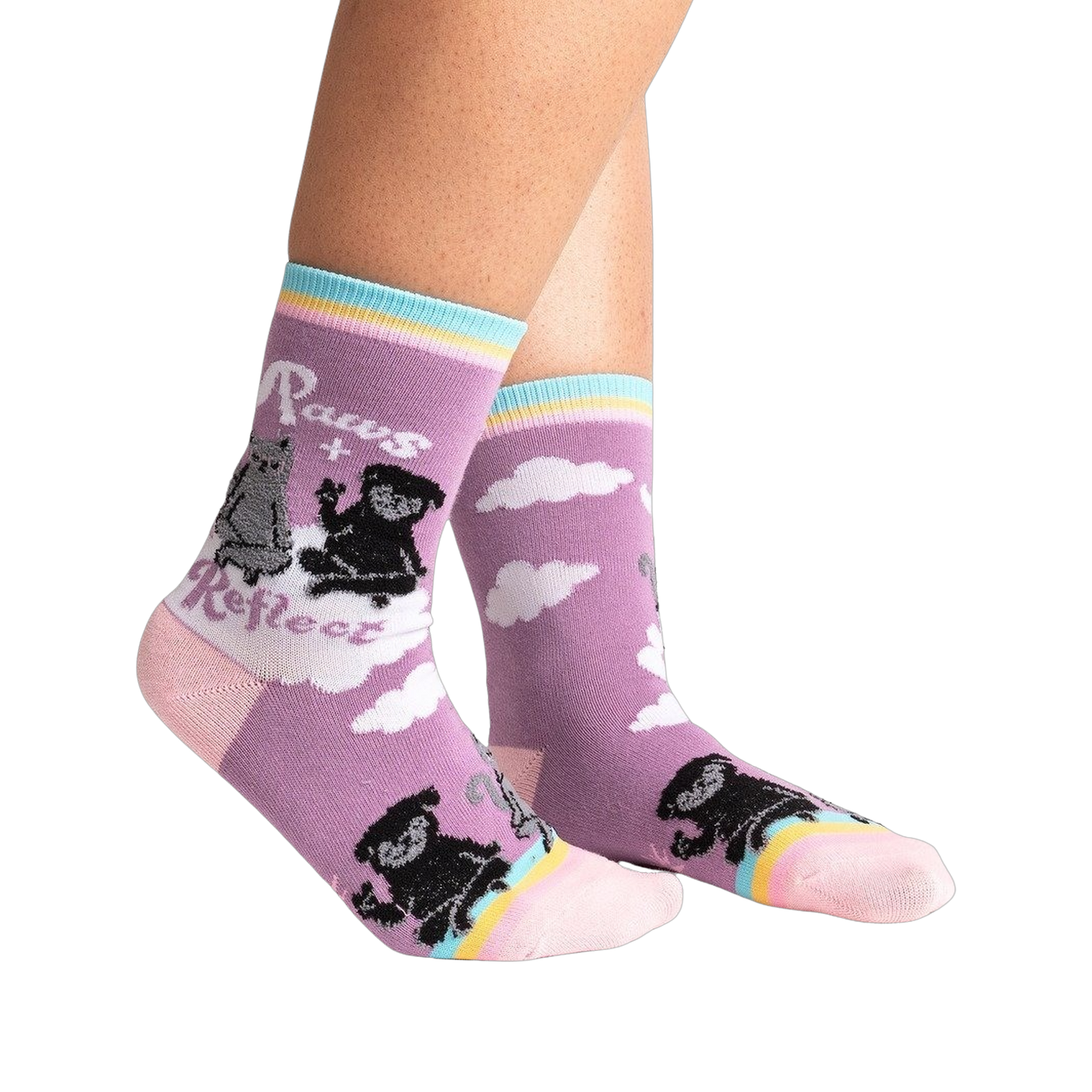 Lifestyle shot of Paws + Reflect socks on a person's legs, showcasing the sock's fit and design.