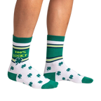 Lifestyle shot showing the socks on a person's legs against a black background.