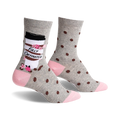 Pair of women's crew socks in gray with brown coffee bean polka dots and a coffee cup graphic that says "Fully Caffinated." Pink accents at the heel and toe.