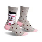 Pair of women's crew socks in gray with brown coffee bean polka dots and a coffee cup graphic that says "Fully Caffinated." Pink accents at the heel and toe.