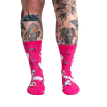 Lifestyle shot of a person's legs wearing Strawberry Milk socks, showcasing the socks on a model.