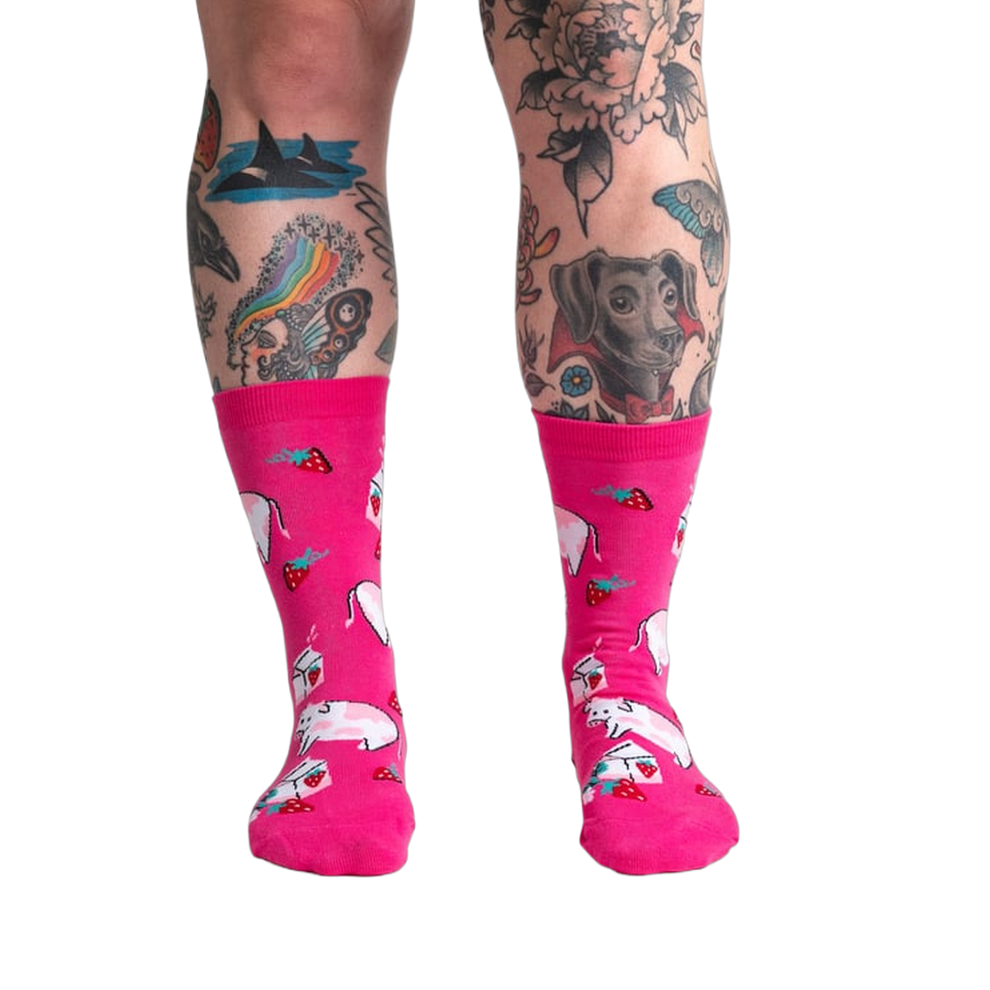 Lifestyle shot of a person's legs wearing Strawberry Milk socks, showcasing the socks on a model.