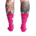 Back view of Strawberry Milk socks on a model, displaying the design on the back of the socks.