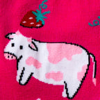 Close-up detail shot of a cow and strawberry design element from Strawberry Milk socks.