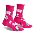 Pair of pink crew socks featuring illustrated cows, strawberries, and milk cartons. Fun, whimsical design.