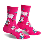 Pair of pink crew socks featuring illustrated cows, strawberries, and milk cartons. Fun, whimsical design.