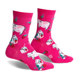 front view of two pink socks with a pattern of pink cows, strawberries, and cartons of milk.