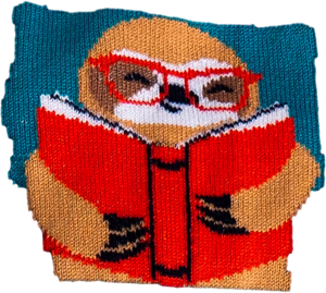 Close-up detail of the sloth reading a book on the sock.