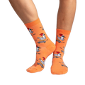Lifestyle shot of Rad Chicken socks on a person's legs, showcasing how the socks look when worn.
