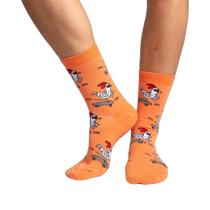 Lifestyle shot of Rad Chicken socks on a person's legs, showcasing how the socks look when worn.