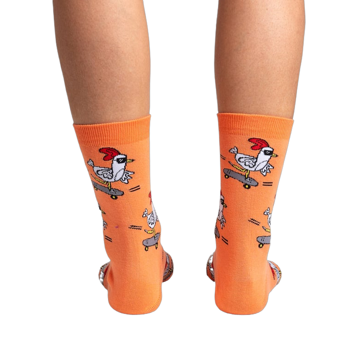 Back view of the Rad Chicken socks on a person's legs, highlighting the design from behind.