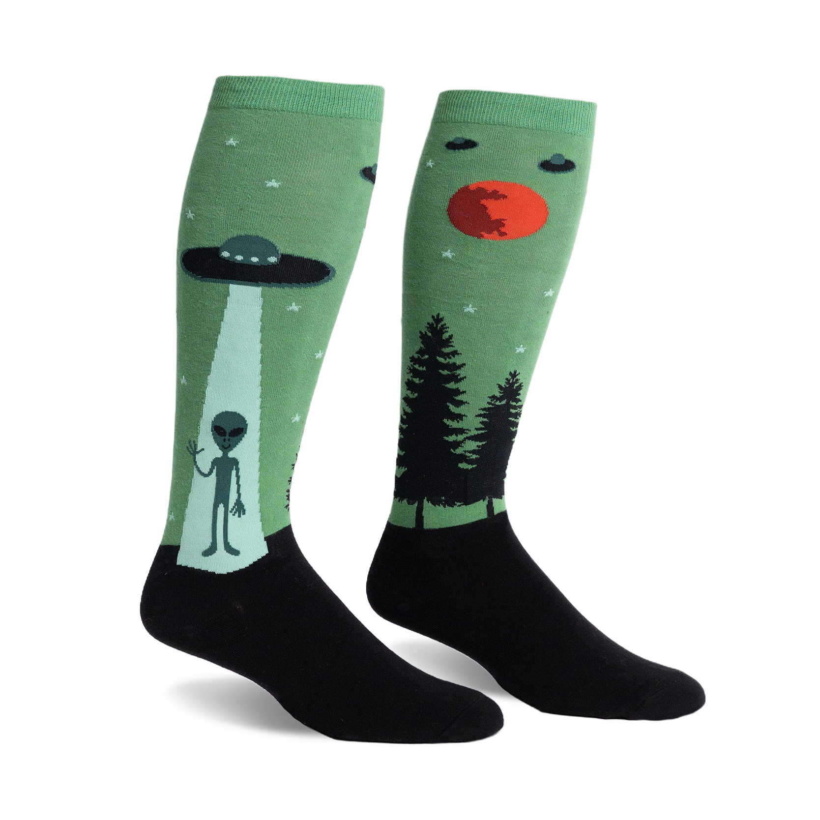 Pair of green and black knee-high socks featuring an alien, UFO, and forest scene.  