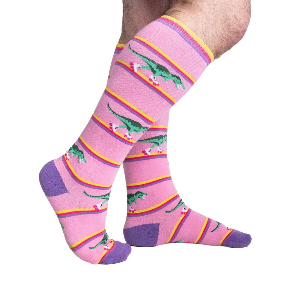 Lifestyle shot showing Rawr-ler Rink socks on a person's legs, showcasing the fit and pattern.