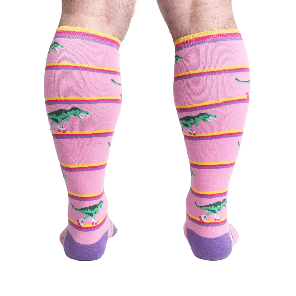 Rear view of a person wearing Rawr-ler Rink socks, highlighting the full sock design from the back.