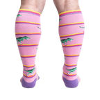 Rear view of a person wearing Rawr-ler Rink socks, highlighting the full sock design from the back.