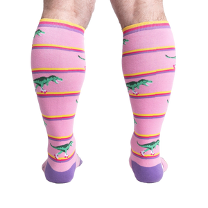 Rear view of a person wearing Rawr-ler Rink socks, highlighting the full sock design from the back.