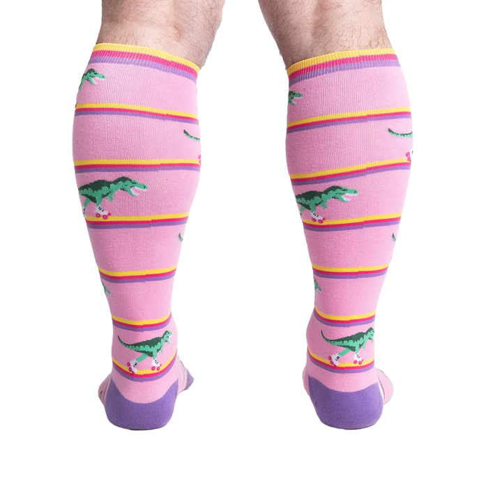 Rear view of a person wearing Rawr-ler Rink socks, highlighting the full sock design from the back.