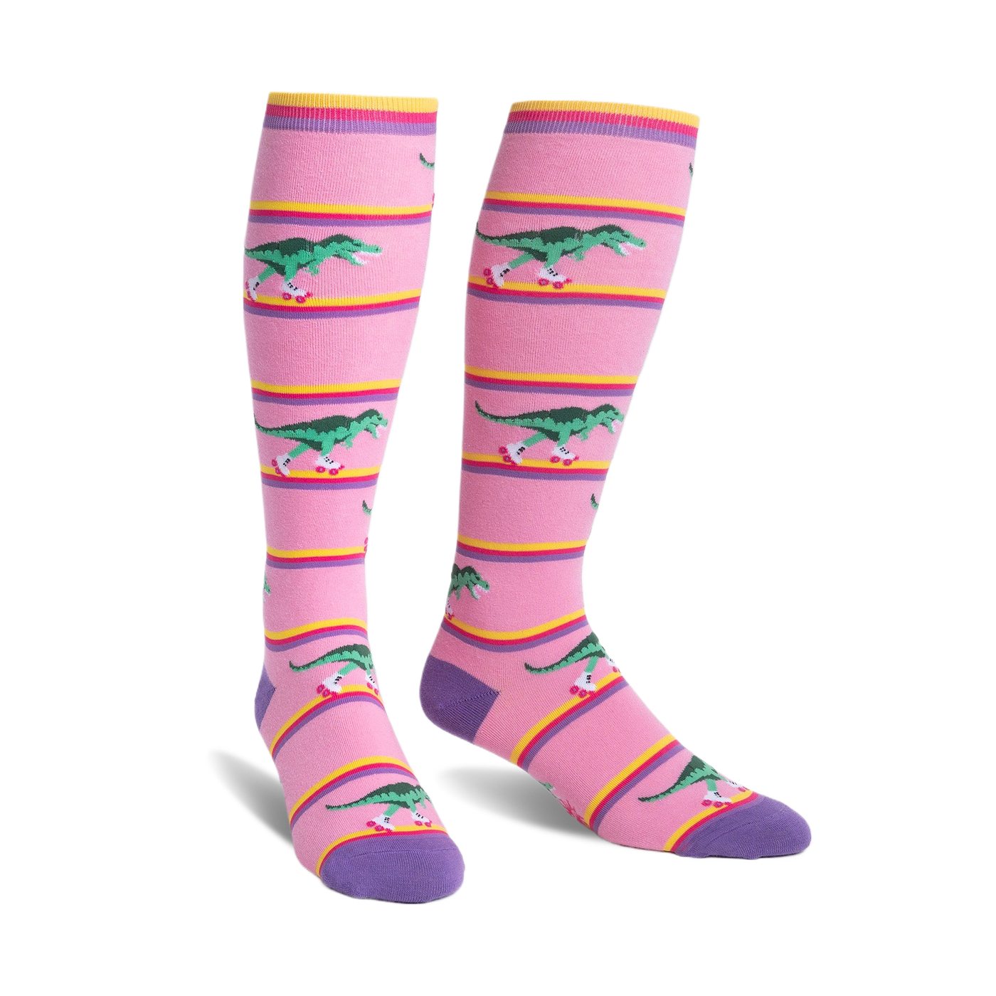 Knee-high socks in pink with purple cuffs.  Design features green T-Rexes on roller skates skating across pink and yellow stripes.