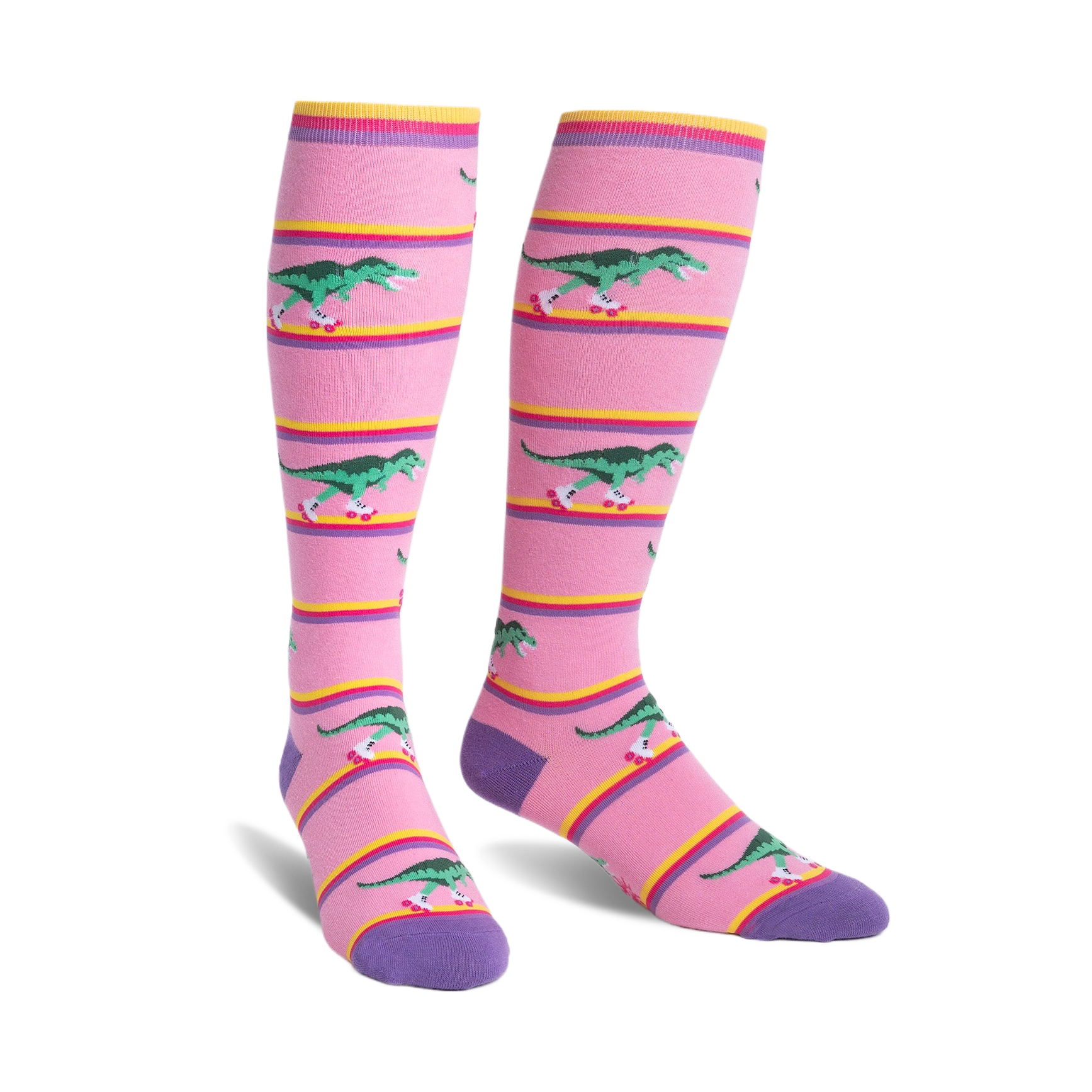 Knee-high socks in pink with purple cuffs.  Design features green T-Rexes on roller skates skating across pink and yellow stripes.