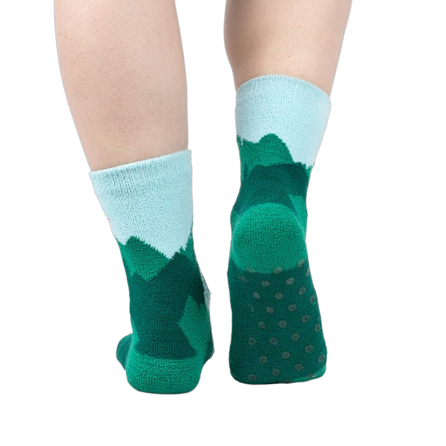 Back view of a person's legs wearing the teal and light blue mountain slipper socks, showcasing the non-slip soles.