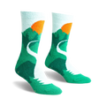 Pair of teal and light blue fuzzy slipper socks with a mountain and sunset design. Non-slip grips on the soles.